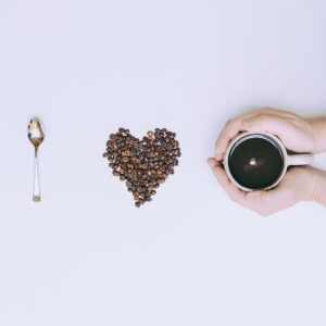 Flat Lay Photography of Mug and Coffee Bean